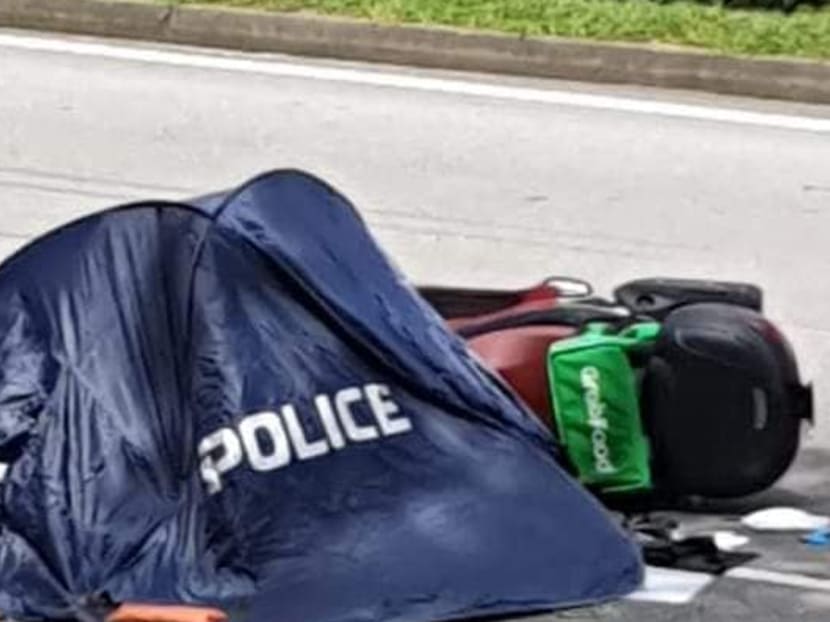 Photos of the incident that have made the rounds on social media show a motorcycle with a GrabFood delivery bag attached to it lying on the side of the road, and a police tent nearby.