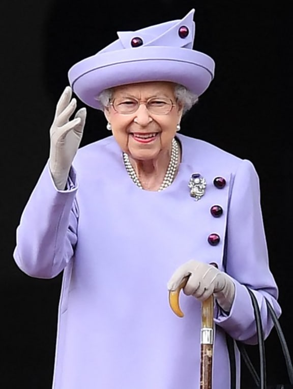 In this file photo taken on June 28, 2022 Britain's Queen Elizabeth II waves as she attends an Armed Forces Act of Loyalty Parade at the Palace of Holyroodhouse in Edinburgh, Scotland.