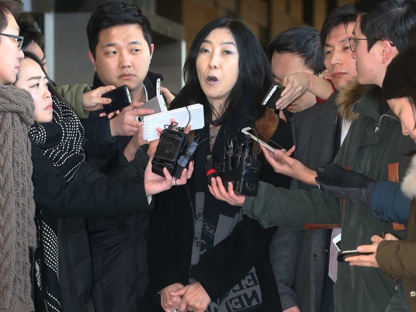 California-resident Shin Eun-mi, centre, talks to the reporters at Seoul District Prosecutors' Office in Seoul, South Korea on Jan 7, 2015. Photo: AP