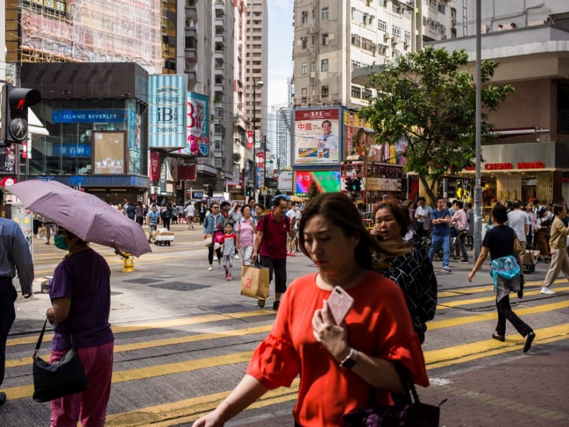Pedestrians at the popular shopping district of Causeway Bay in Hong Kong on November 1, 2018,
