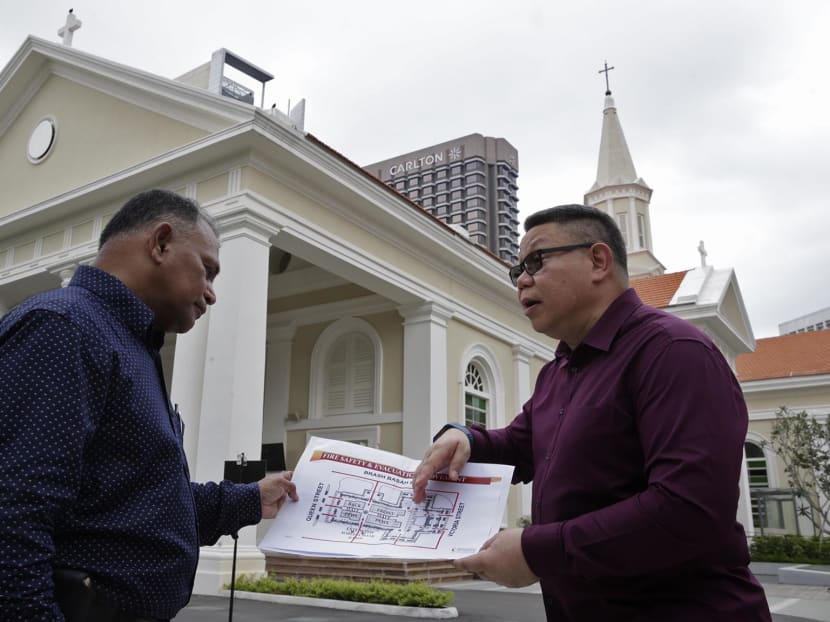Andre Ahchak (R) Director, Archdiocesan Communications Office and Abdul Wahab (L), Vice-Chair, Al-Khair Mosque discussing plans related to SGSecure at Cathedral of the Good Shepherd. Photo: Wee Teck Hian/TODAY