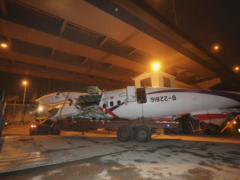 Wreckage of TransAsia Airways plane Flight GE235 is transported on the back of a truck after it crash landed into a river, in New Taipei City, yesterday (Feb 5). Photo: Reuters
