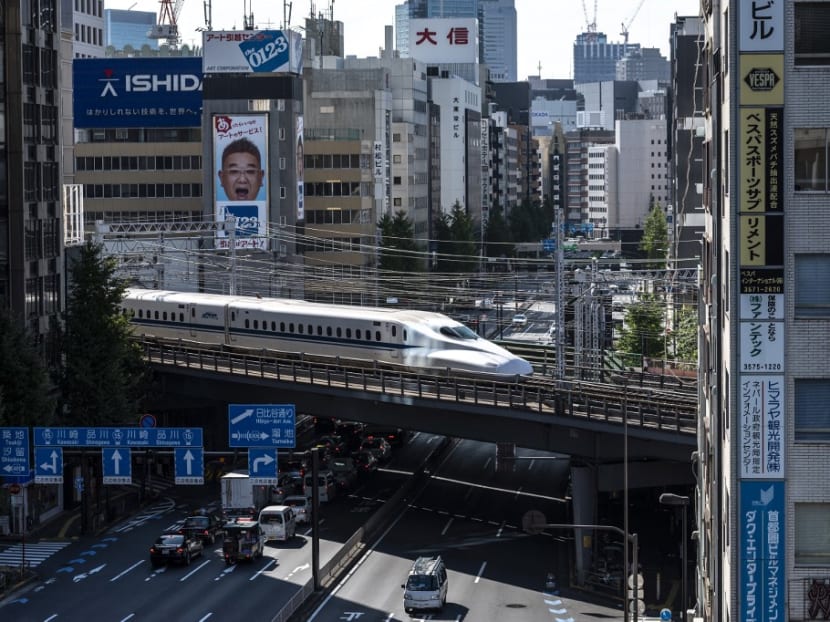 A shinkansen, or high speed bullet train, leaves Tokyo on Nov 4, 2021.