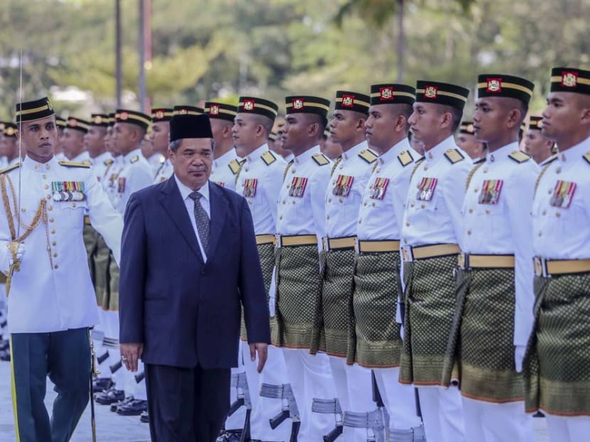 Mr Mohamad Sabu inspects a ceremonial Guard of Honour on his first day at work as Defence Minister in the Ministry of Defence (Mindef), Kuala Lumpur. He says the ministry will conduct an internal probe and audit before determining the substance behind allegations regarding defence spending under the previous Barisan Nasional administration.