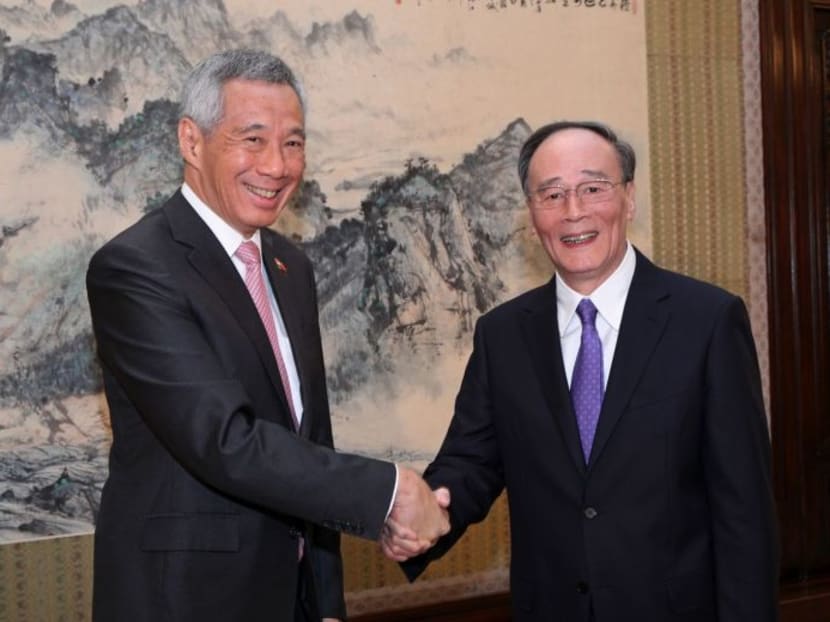 PM Lee Hsien Loong (left), seen here with China's Secretary of the Central Commission for Discipline Inspection, Wang Qishan. Photo: MCI