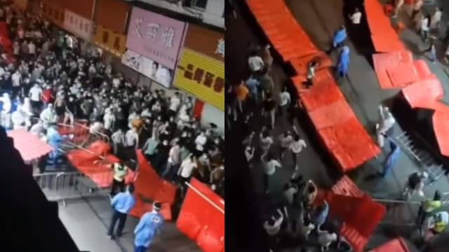 广州民众不满防疫措施 推翻栅栏与警察起冲突