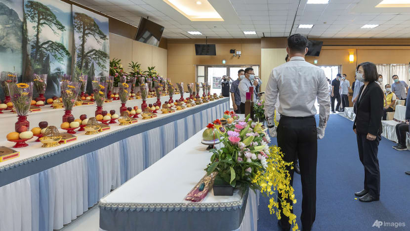Taiwan's leader pays respects to 46 dead in building inferno Taiwan's leader pays respects to 46 dead in building inferno