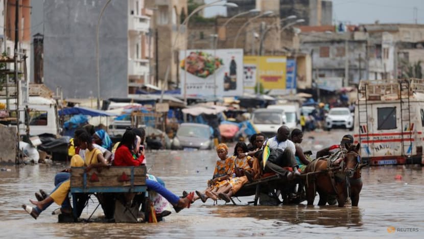 Senegal capital wades through floodwater after heavy rain Senegal capital wades through floodwater after heavy rain