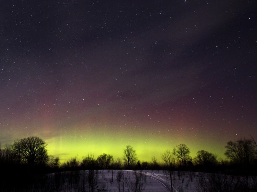 The glow of the Aurora Borealis, or Northern Lights, is seen in the horizon in the Kawartha Lakes region, southern Ontario February 23, 2015. Photo: Reuters