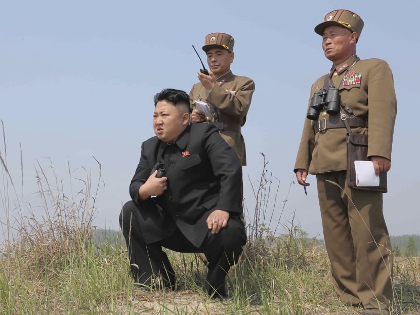 North Korean leader Kim Jong Un (C) guides the multiple-rocket launching drill of women's sub-units under KPA Unit 851, in this undated file photo released by North Korea's Korean Central News Agency (KCNA) April 24, 2014. Photo: Reuters