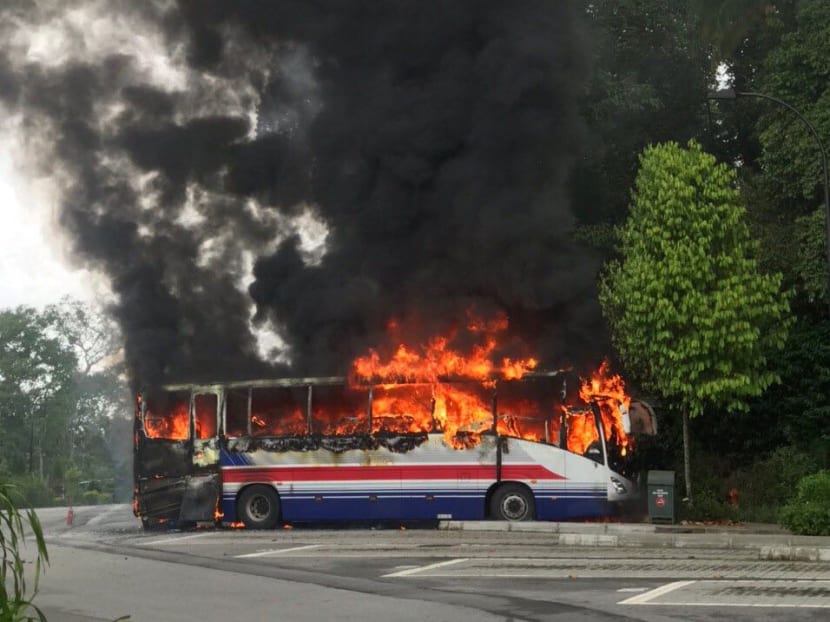 A photo sent by a TODAY reader of a bus on fire at a Botanic Gardens car park.
