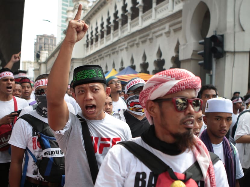 Many who attended the rally wore traditional Malay attire, with the males wearing a headpiece known as a “tanjak”, typically adorned by Malay warriors. Others carried flags inscribed with Quranic verses.