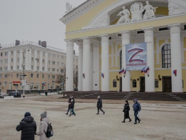 A pro-war Z sign at the theater in Kaluga, Russia says, “We don’t leave our own behind,” on Dec 3, 2022. More than nine months after the invasion, neither the war effort nor the economy has collapsed, and the economic pain is still limited for many Russians. 
