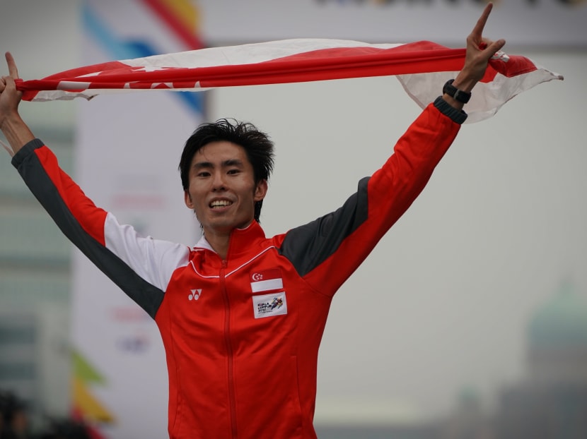 Soh Rui Yong celebrates defending his men's marathon gold medal at the SEA Games. Photo: Jason Quah/TODAY