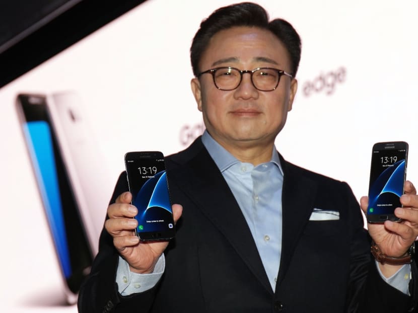 Mr DJ Koh, President of Mobile Communications Business, Samsung Electronics, holding up the Samsung Galaxy S7 edge (left) and the Galaxy S7 announced on Feb 21, 2016 (Monday, Singapore time) at the Mobile World Congress in Barcelona. Photo: Samsung
