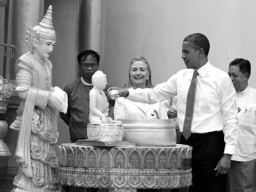 US President Barack Obama and Secretary of State Hillary Clinton visiting the Shwedagon Pagoda in Myanmar on Monday. REUTERS