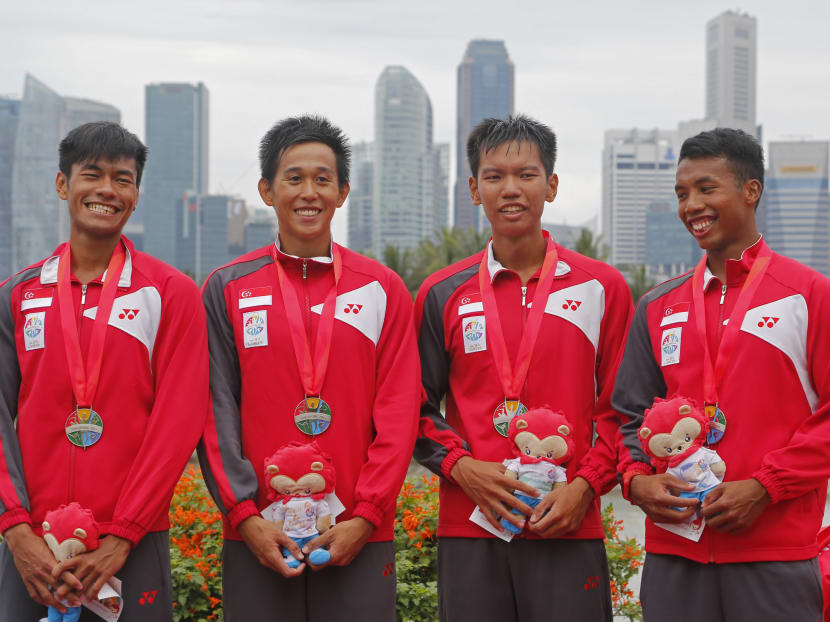 From left to right: Singapore's Rafa'ee Syahir Ezekiel, Pek Hong Kiat, Lee Zong Han and Hamzah Nadzrie Hyckell celebrate their silver medals on the podium after coming in second in the men's lightweight four (1000m) final. Photo: SINGSOC / Action Images via Reuters