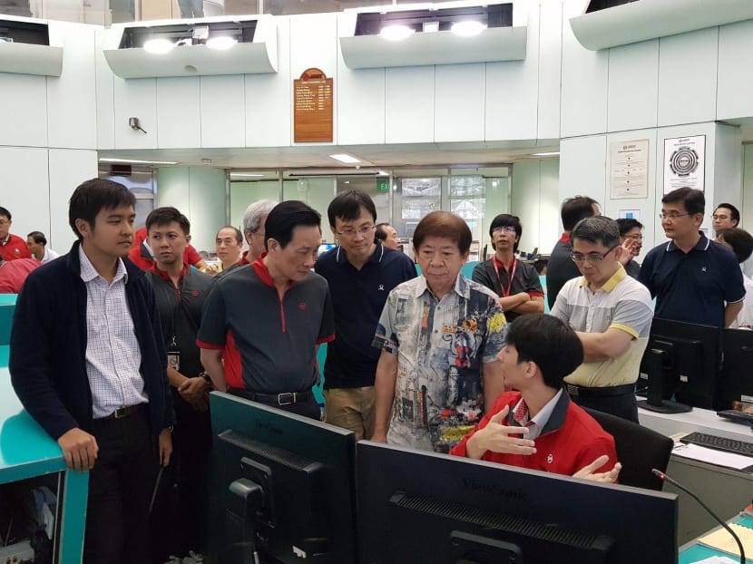 Transport Minister Khaw Boon Wan visited SMRT’s Operations Control Centre on Saturday (March 10) night to observe tests on the NSEWL of the new signalling system, supplied by French multinational firm Thales and which allows trains to arrive at closer intervals during peak hours. Photo: SMRT via Facebook