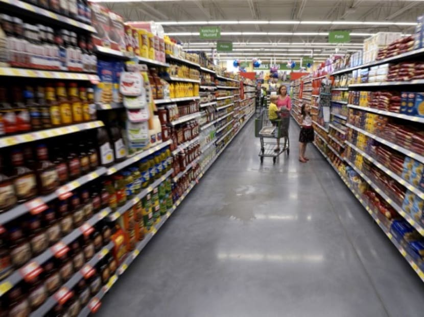 A family shops at the Wal-Mart Neighborhood Market in Bentonville. Photo: Reuters