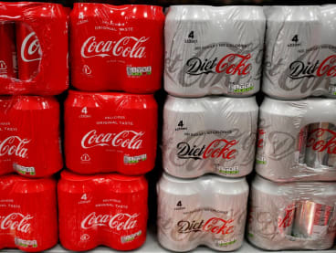 Packs of Coca Cola and Diet Coke seen for sale in a motorway services shop in Reading, Britain on Jan 25, 2019. 