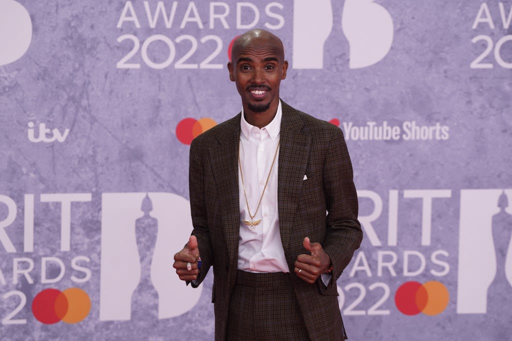 British track athlete Mo Farah poses on the red carpet upon his arrival for the Brit Awards 2022 in London on Feb 8, 2022.<br />
British track athlete Mo Farah poses on the red carpet upon his arrival for the Brit Awards 2022 in London on Feb 8, 2022.<br />
