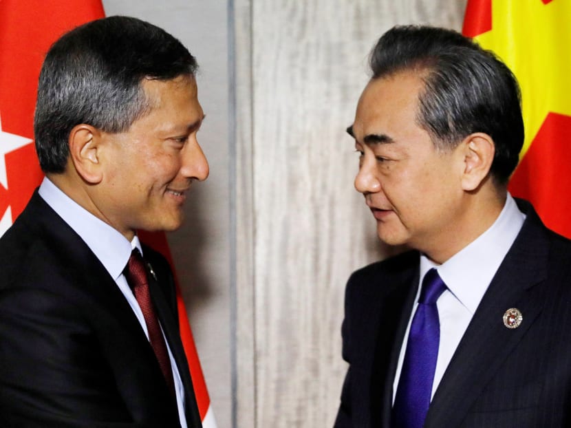 Foreign Minister Vivian Balakrishnan with his Chinese counterpart Wang Yi at the 50th Asean Regional Forum. Dr Balakrishnan said Asean-Chinese relations are on a ‘positive trajectory’. Photo: Reuters