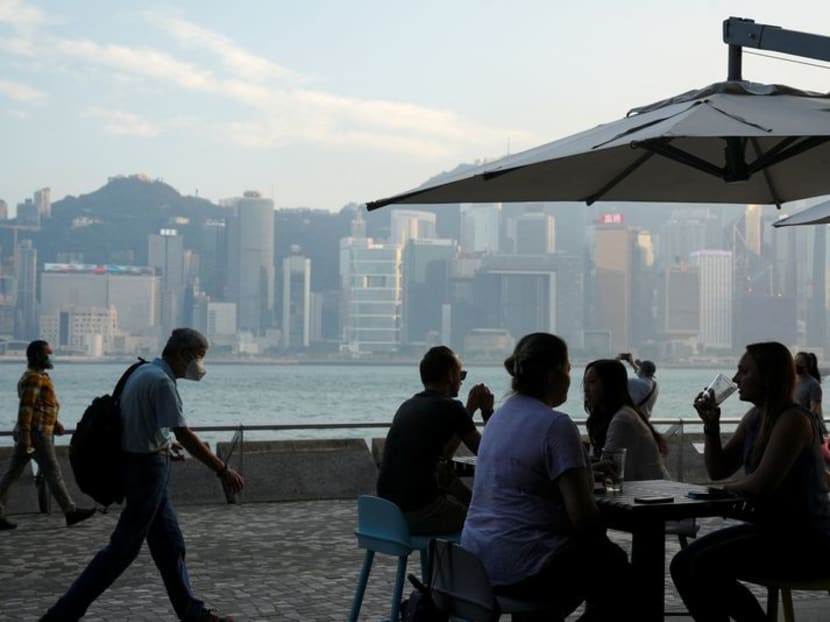 People dine at a restaurant nearby Victoria Harbour after the government eased the Covid-19 restrictions on businesses, in Tsim Sha Tsui district in Hong Kong, China on April 21, 2022. 