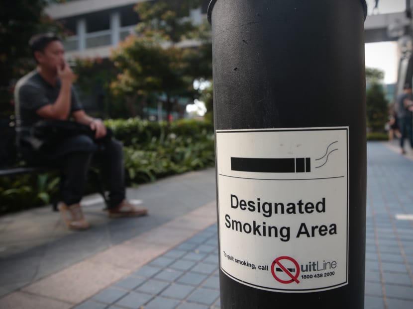 A file photo showing a notice of a designated smoking area in a public space.