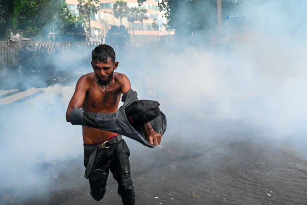 Police use tear gas shells to disperse students taking part in an anti-government protest demanding the resignation of Sri Lanka's president Gotabaya Rajapaksa over the country's crippling economic crisis, in Colombo on May 29, 2022.
