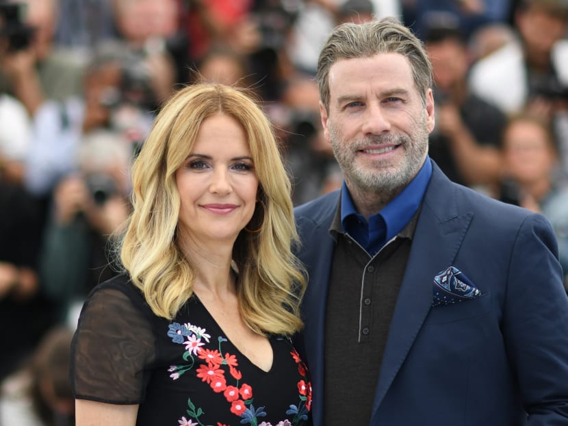 In this file photo taken on May 15, 2018, US actor John Travolta and his wife, actress Kelly Preston, pose during a photocall for the film "Gotti" at the 71st edition of the Cannes Film Festival in Cannes. Kelly Preston died after a battle with breast cancer at the age of 57, US media reported on July 12, 2020.