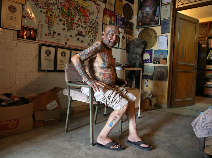Gallery: For world records, Indian man removes teeth and gets over 500 tattoos