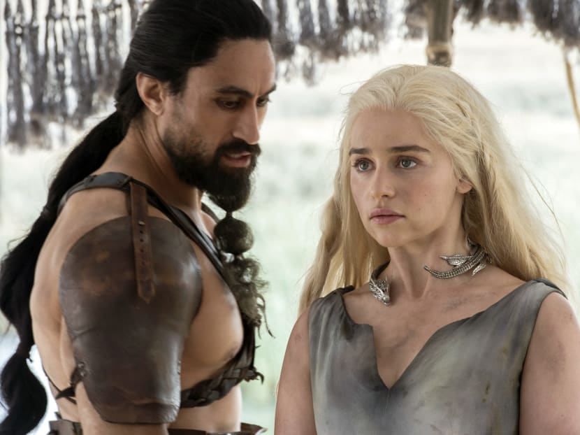 Joe Naufahu, left, and Emilia Clarke in a scene from the season six premiere of Game of Thrones. Photo: HBO via AP