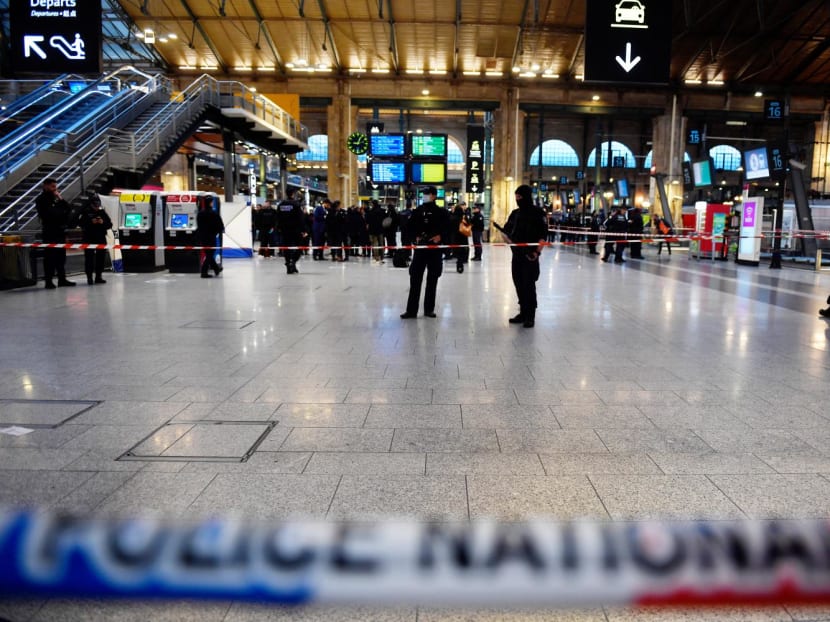 French police cordon off an area at Paris' Gare du Nord train station, after several people were lightly wounded by a man wielding a knife on Jan 11, 2023.