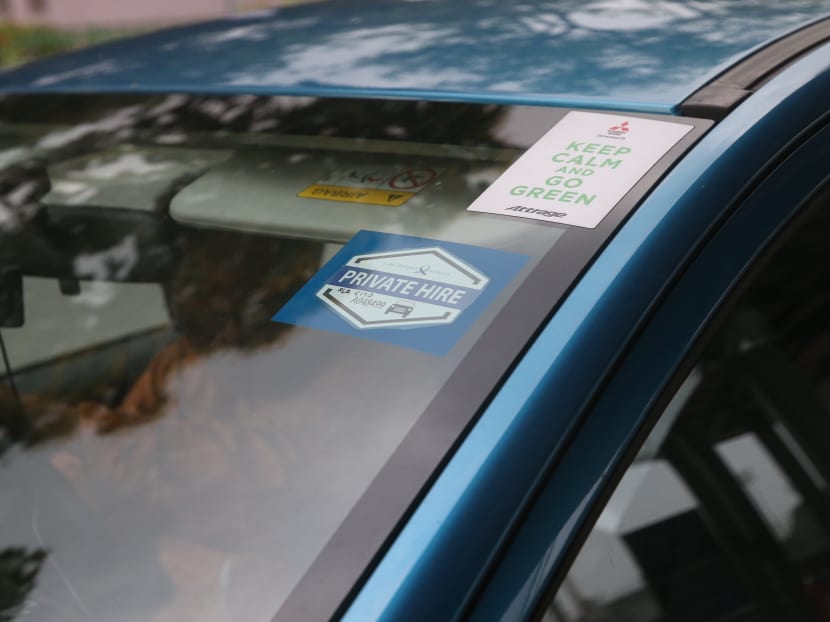 A private hire car decal on display. With less than three months to go before the deadline, 34,000 private-hire car drivers have not passed the test for a Private Hire Car Driver's Vocational Licence (PDVL). Photo: Ooi Boon Keong/TODAY