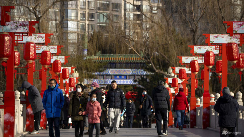 Chinese pray for health in new year as COVID-19 death toll rises