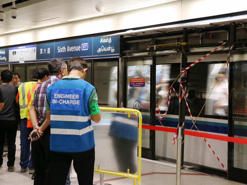 Engineers at the scene after the dislodged platform door disrupted train services for about 40 minutes between the King Albert Park and Sixth Avenue stations on the Downtown Line. Photo: Koh Mui Fong
