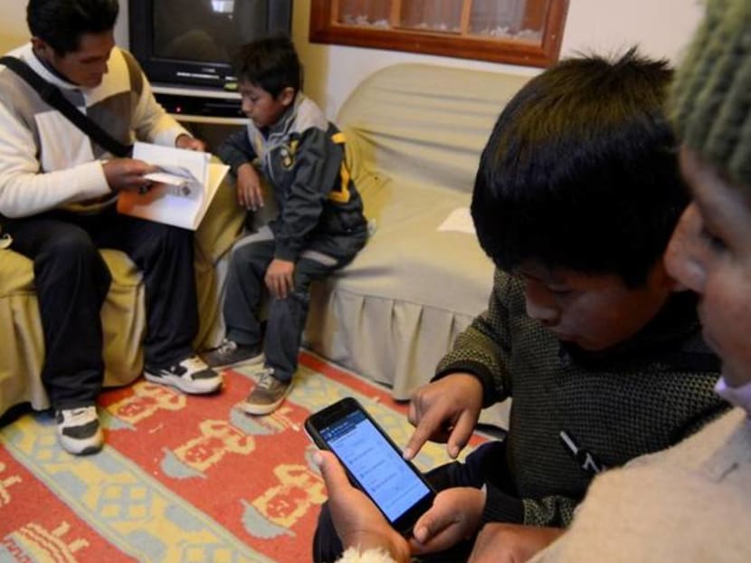Bolivian parents go back to class to help their kids study online