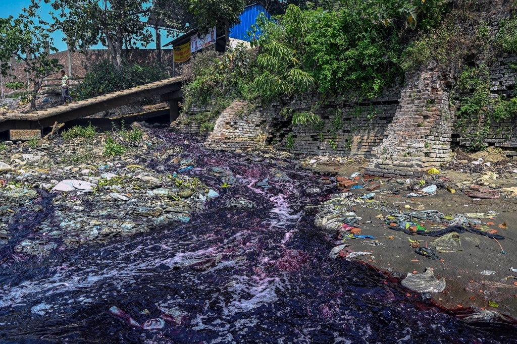 In this picture taken on March 6, 2022, industrial effluents enter a canal that leads to the Shitolokkhya River in Narayangong. In this picture taken on March 6, 2022, industrial effluents enter a canal that leads to the Shitolokkhya River in Narayangong.