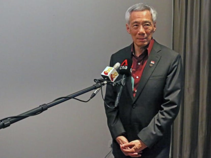 <p>Prime Minister Lee Hsien Loong speaking to Singapore media at the end of the Commonwealth Heads of Government Meeting in Kigali on June 25, 2022.</p>
