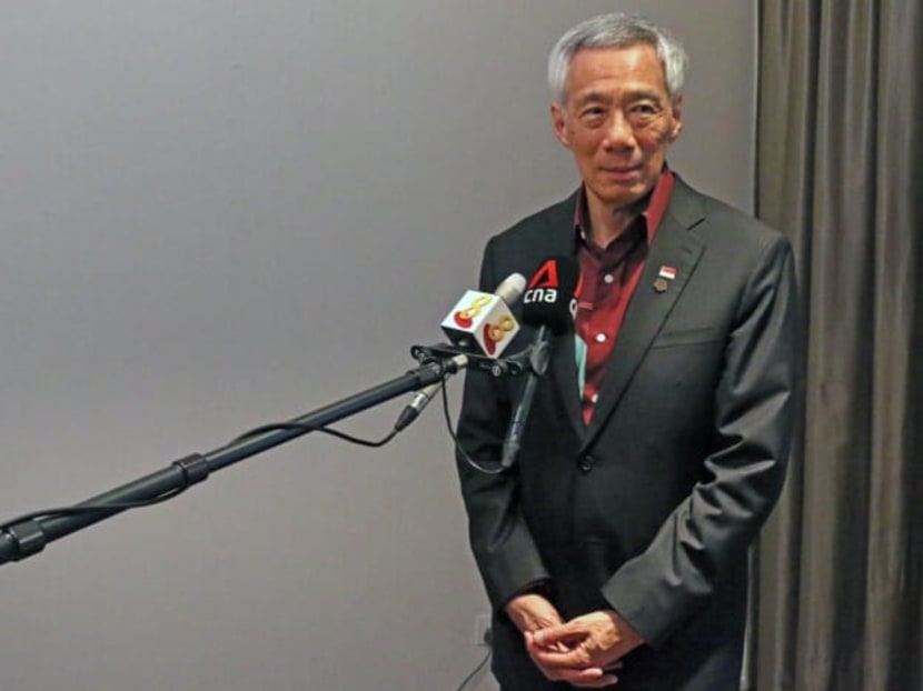 <p>Prime Minister Lee Hsien Loong speaking to Singapore media at the end of the Commonwealth Heads of Government Meeting in Kigali on June 25, 2022.</p>
