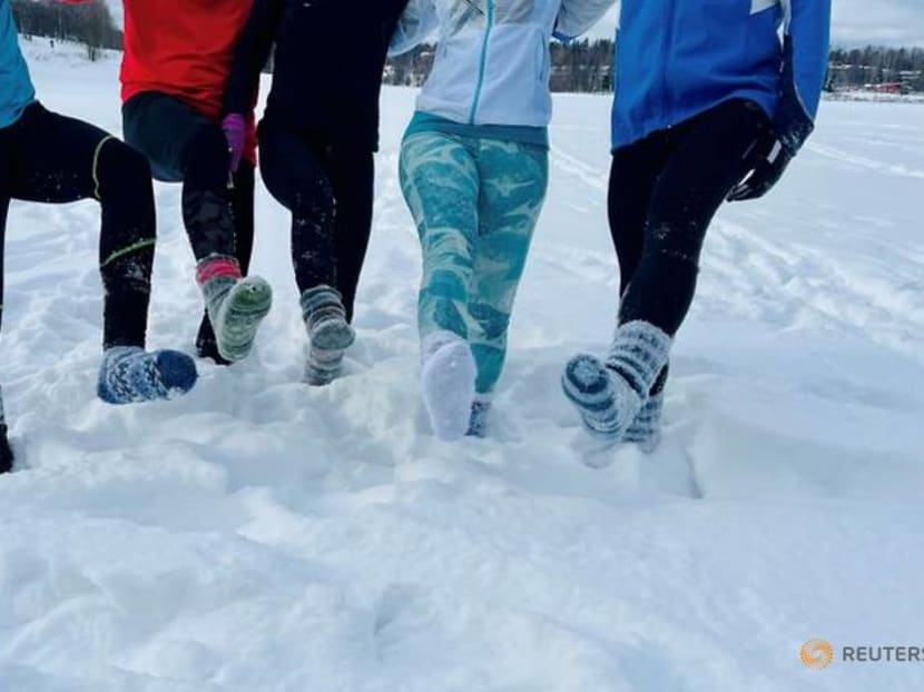Weary of COVID restrictions, Finns take up running in deep snow in socks Weary of COVID restrictions, Finns take up running in deep snow in socks
