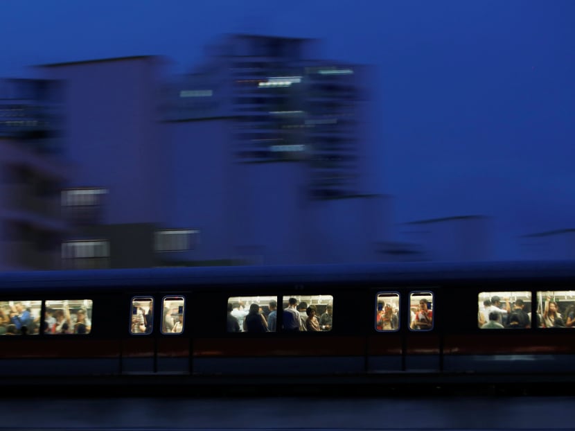 Commuters riding an SMRT train in the evening in Singapore. Photo: Reuters