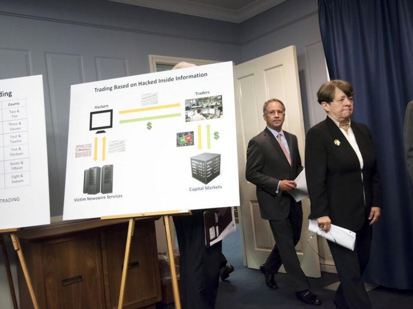 The US Attorney for the District of New Jersey Paul Fishman, and Securities and Exchange Commission Chair Mary Jo White, arrive at a news conference to detail the insider trading scheme. PHOTO: THE NEW YORK TIMES