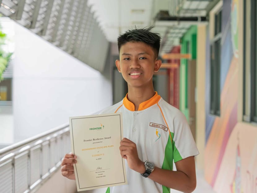 Muhammad Haziq Alias with his Frontier Resilience Award. Muhammad Haziq Alias with his Frontier Resilience Award.