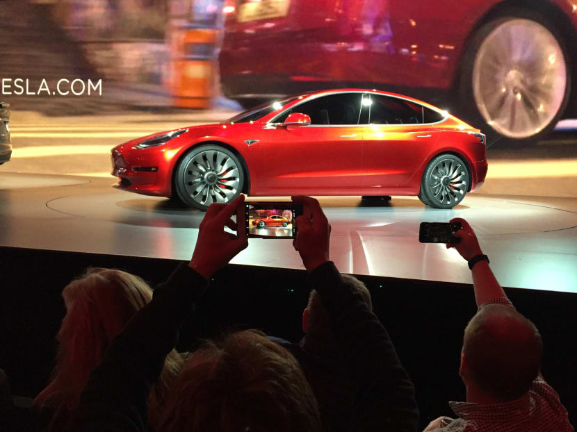 Tesla Motors unveils the new lower-priced Model 3 sedan at the Tesla Motors design studio in Hawthorne, Calif., on March 31, 2016. Photo: AP