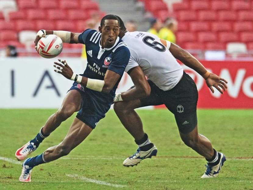 Perry Baker of the United States getting past his Fiji opponent on Sunday. Photos: Singapore Maven