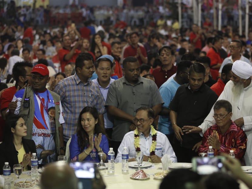 Photo of the day: Datuk Seri Anwar Ibrahim attending a dinner on Thursday (Oct 11) with supporters at a local temple in Lukut ahead of Saturday's by-election in Port Dickson.