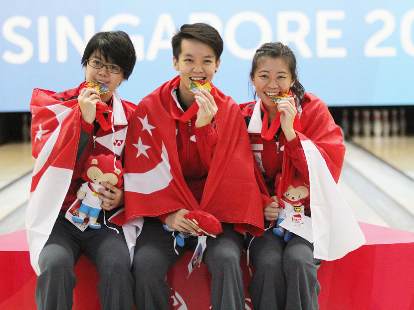 From left: Cherie Tan, Shayna Ng and Bernice Lim celebrating their win in the Women's Trios. Photo: Jaslin Goh