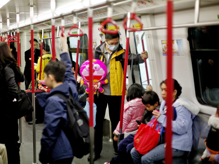 Commuters on an MTR train in Hong Kong. Photo: Reuters