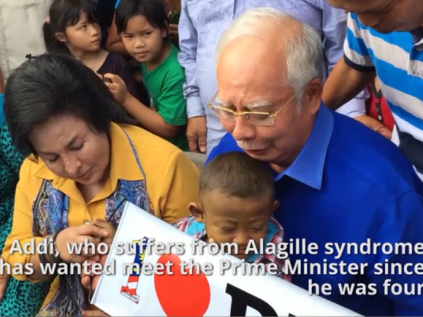 A screen capture of the video showing Prime Minister Najib Razak and his wife Rosmah Mansor with six-year-old Addi Asyraaf Mohamad Missbahuddin. Photo: Malay Mail Online